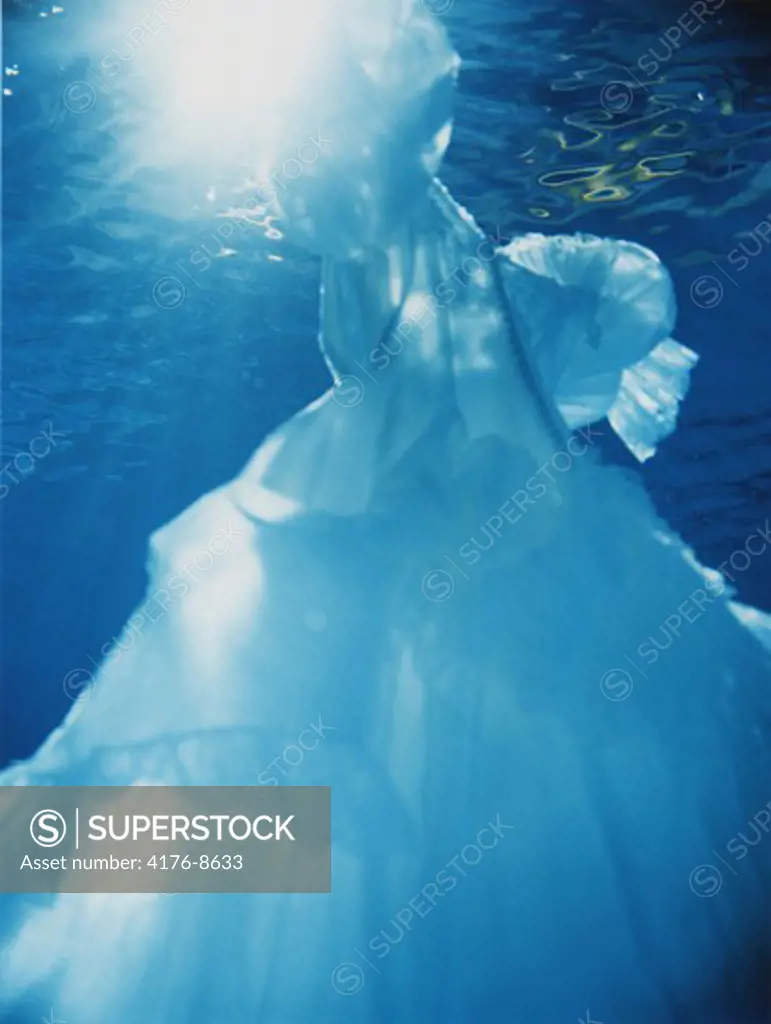 A ball gown floating in water
