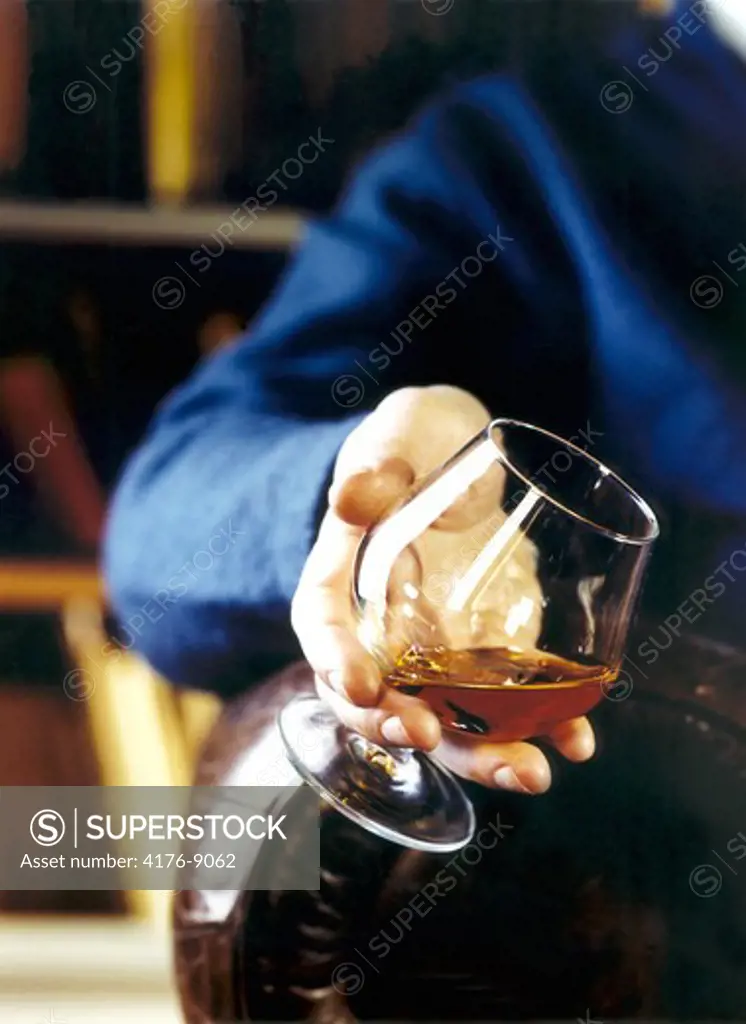 A person holding wine glass