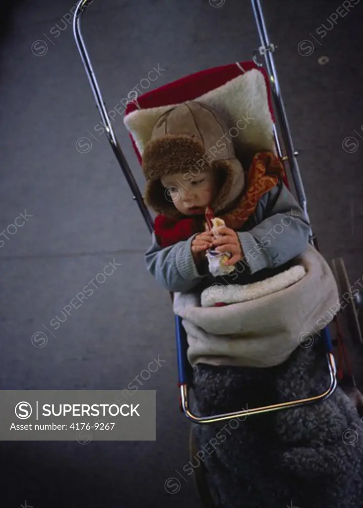 Overhead view of a child sitting in pram