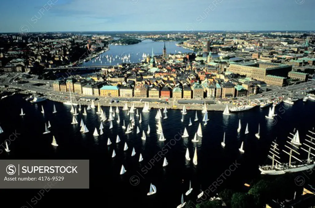 Aerial view of sailboats sailing in sea past the old district in Stockholm, Gamla Stan