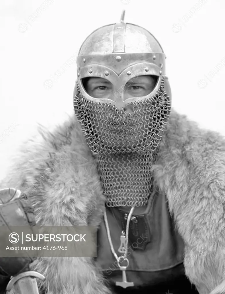 Portrait of a man wearing a Viking helmet and a fur coat, Iceland