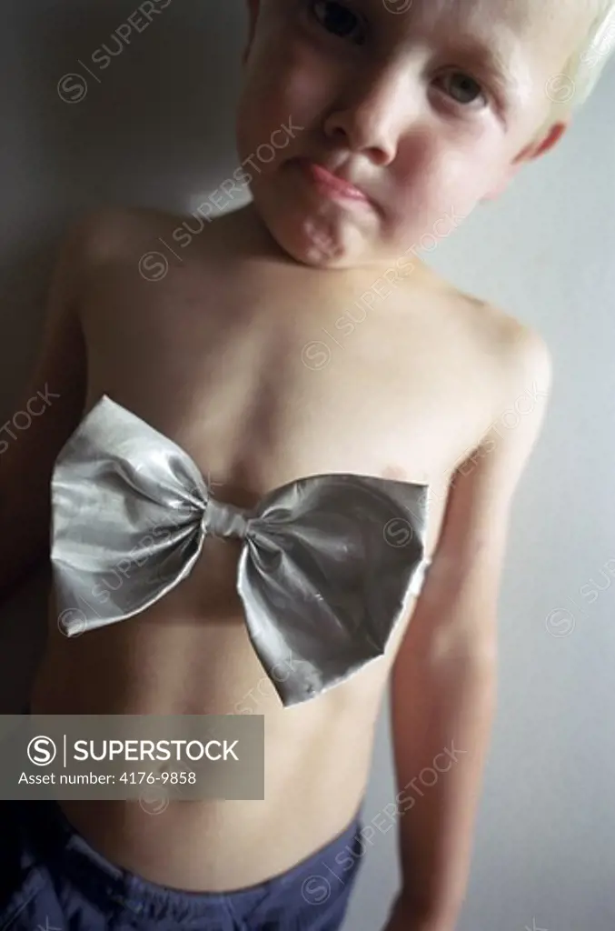 A five-year-old boy with a bowtie on his chest. Sweden