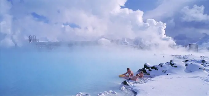 Iceland - Three people relaxing in a geothermal spa, Blue Lagoon