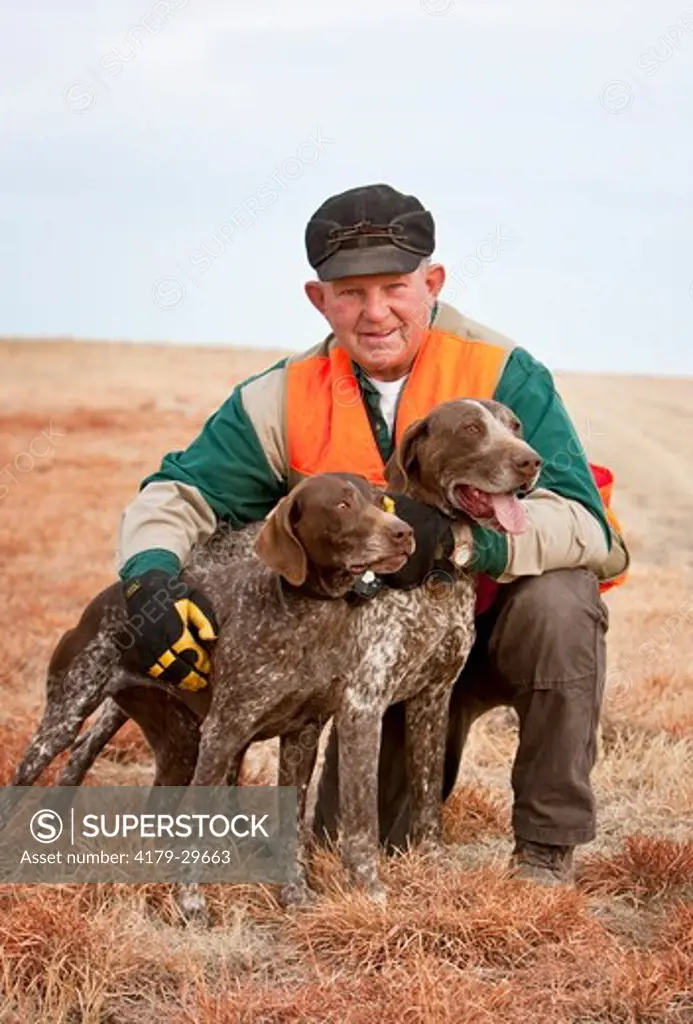 Domestic Dog, German Shorthair Pointer Trainer *MR posing with Dogs, Eastern Colorado Darren Bennett Photo