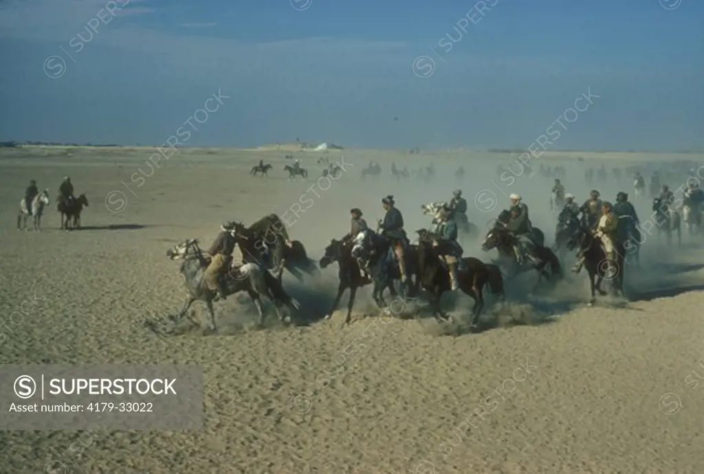 Buzkashi Game: Riders try to put dead Calf in Goal, Mazar-I-Sharif, Afghanistan