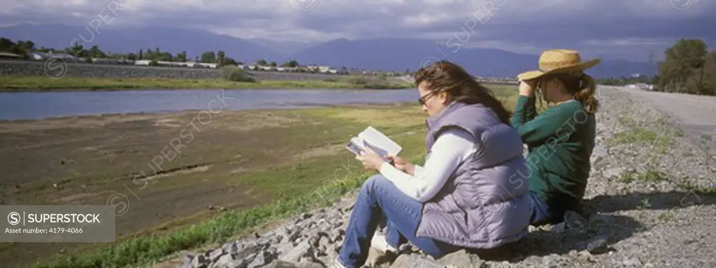 Kim Holcomb and Gloria Reid watching birds on the San Gabriel River. Trust for Public (TPL) employee in Los Angeles. City of Industry, Woodland Farms, California