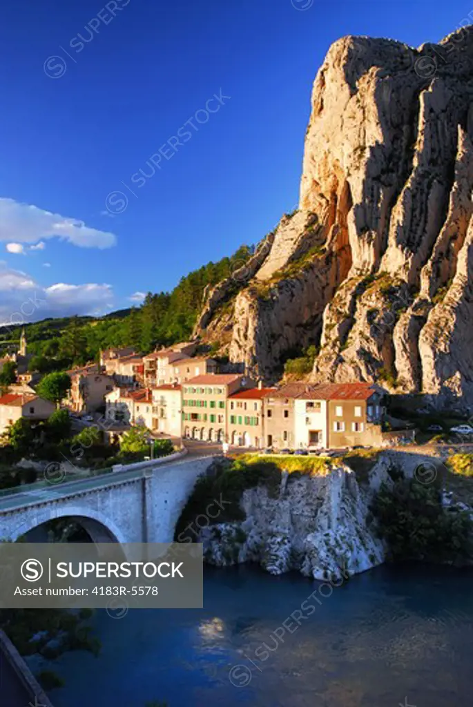 Houses at the base of a cliff in town of Sisteron in Provence