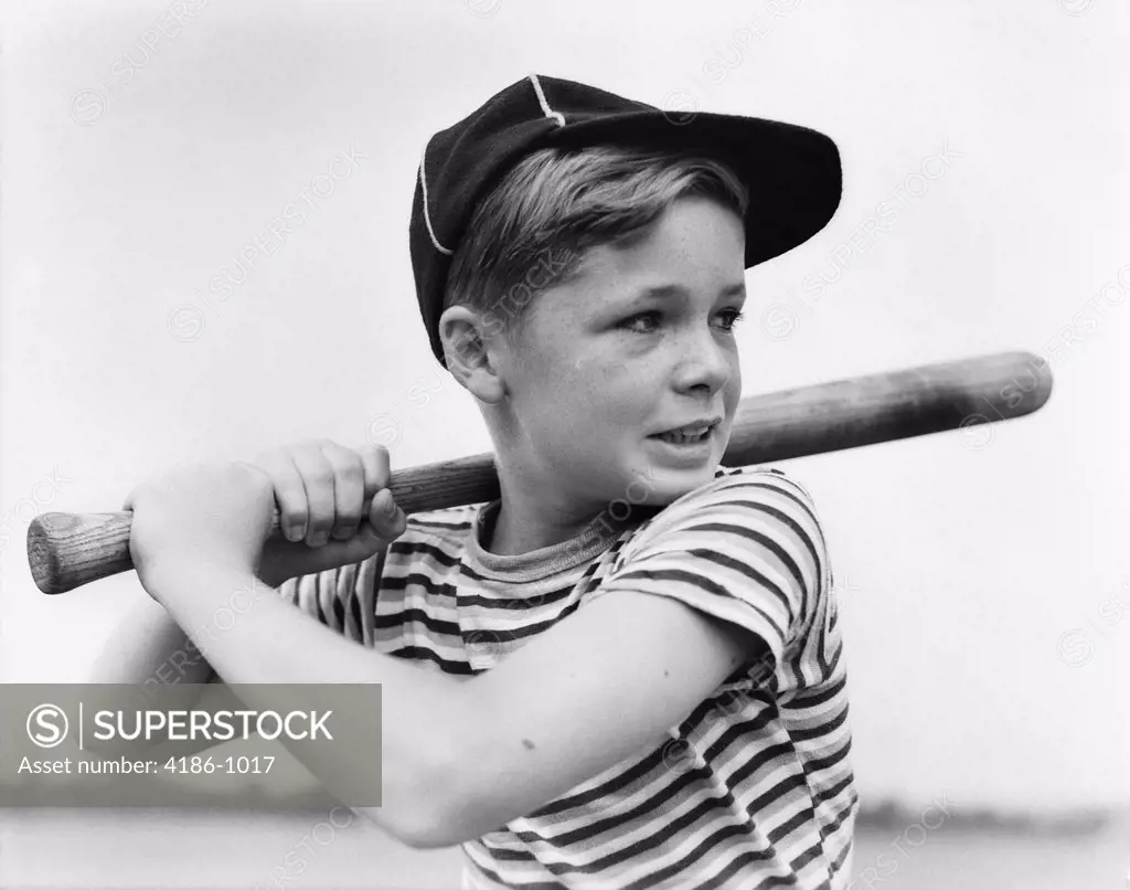 1930S Boy At Bat Wearing A Horizontal Striped Tee Shirt And Baseball Cap