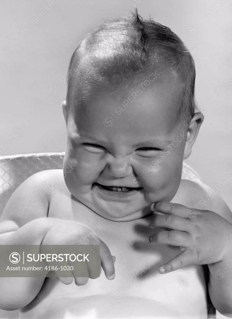 1960S Portrait Of Smiling Baby Indoor Making A Funny Face