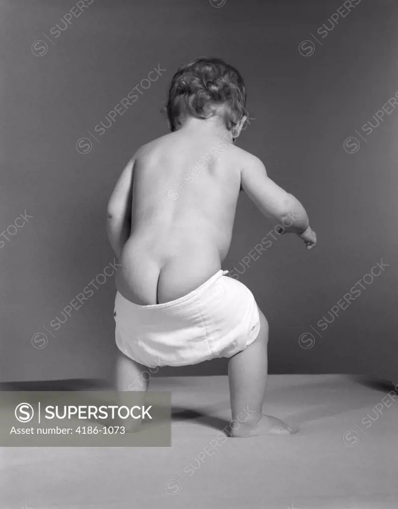 1940S 1950S 1960S Baby With Droopy Diaper Falling Down Showing Nude Bottom Butt