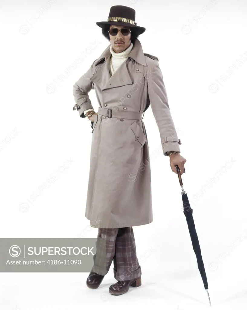 1970S Full Length Portrait Stylish African American Man Wearing Sunglasses Wide Brim Hat Trench Coat Leaning On Umbrella