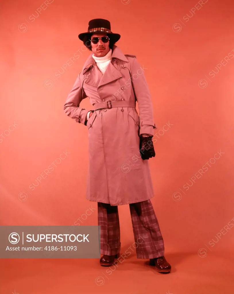 1970 African American Man In Tan Trench Coat Aviator Sunglasses Hat Gloves Turtleneck Plaid Bellbottom Plaid Pants