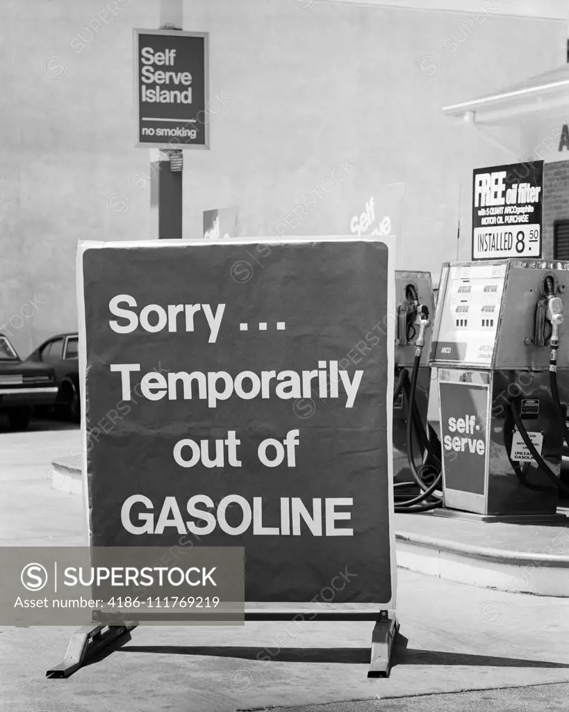 1970s CLOSE-UP SORRY TEMPORARILY OUT OF GASOLINE SIGN AT SELF SERVICE GAS STATION DURING 1973 OPEC OIL SHORTAGE CRISIS