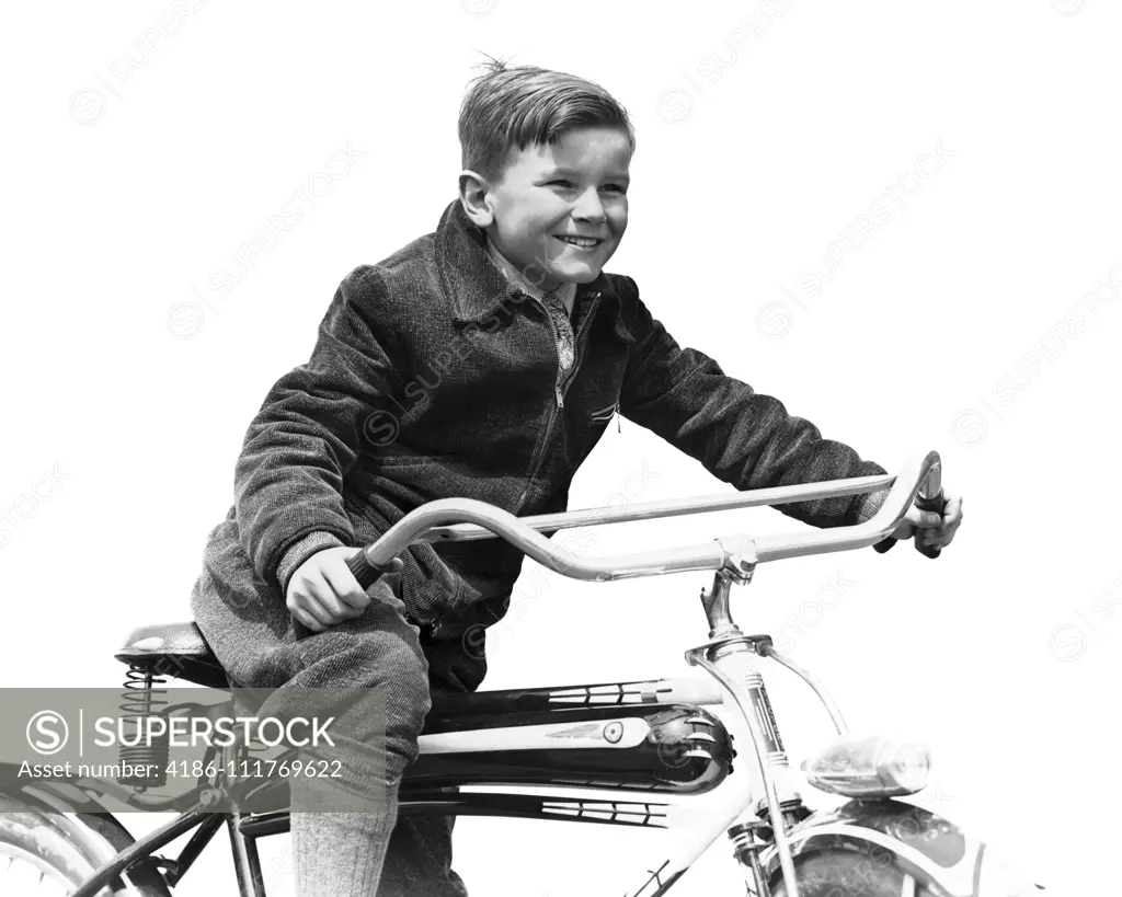 1930s SMILING BOY IN AUTUMN CORDUROY JACKET KNEE SOCKS AND PANTS  PEDALING HEAVY AMERICAN SPACE SHIP DESIGN STYLE BICYCLE