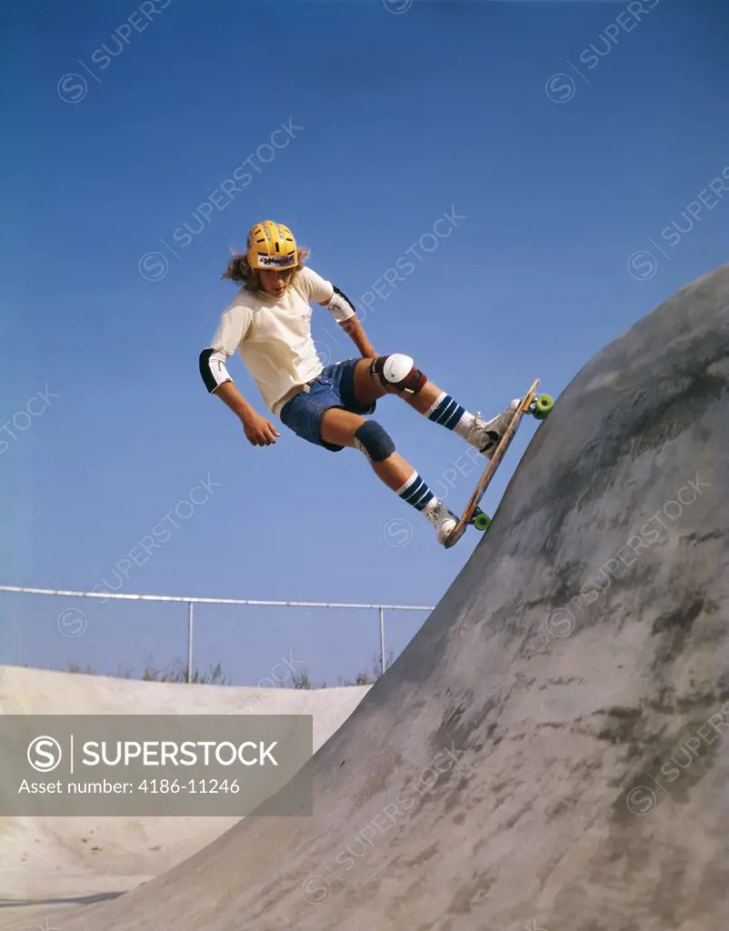 1970S Teen Boy On Skateboard Obstacle Course Uphill Balance Skating Fun Safety Yellow Helmet Knee Elbow Pads Blue Sky
