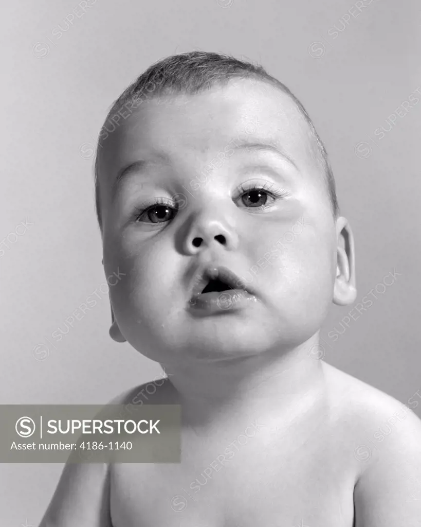 1960S Portrait Baby With Large Jowls & Dopey Look On Face Looking At Camera