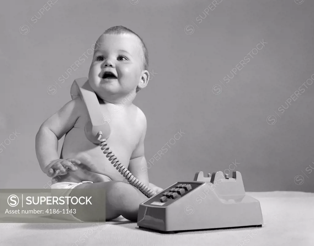 1960S 1970S Smiling Baby In Diaper With Telephone