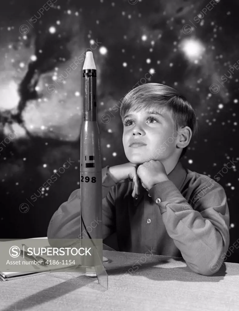 1960S Boy With Model Rocket And Outer Space Background