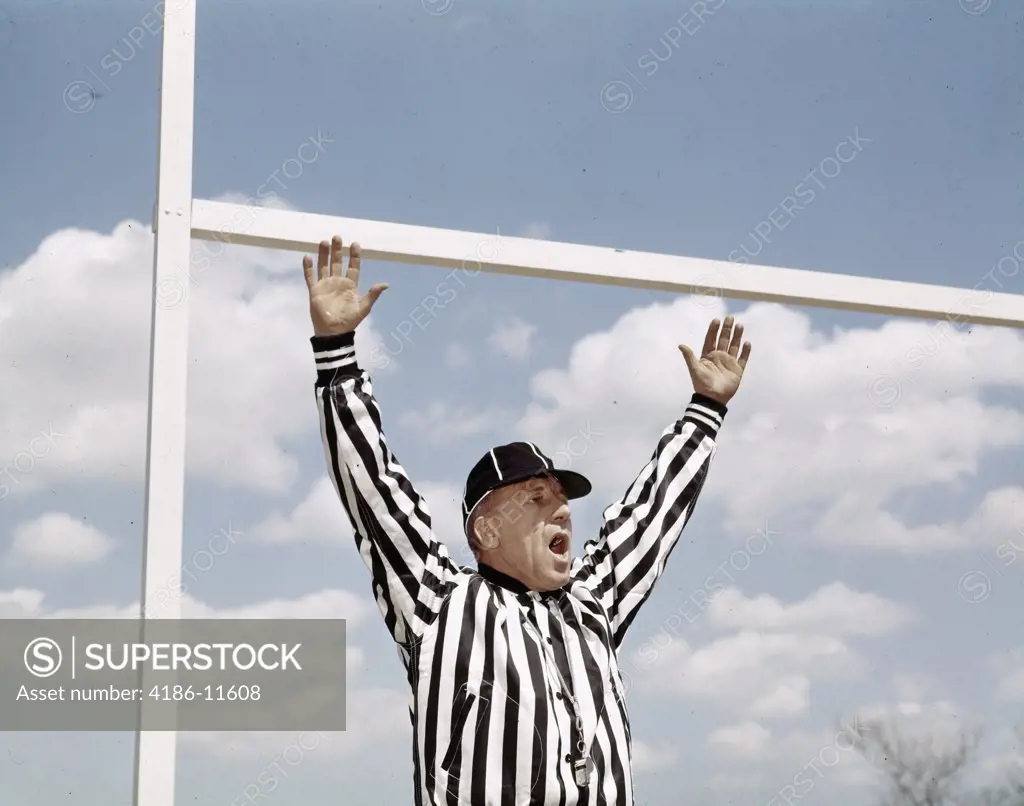 1960S Referee At American Football Game Making Good Touchdown Signal At Goal Post 