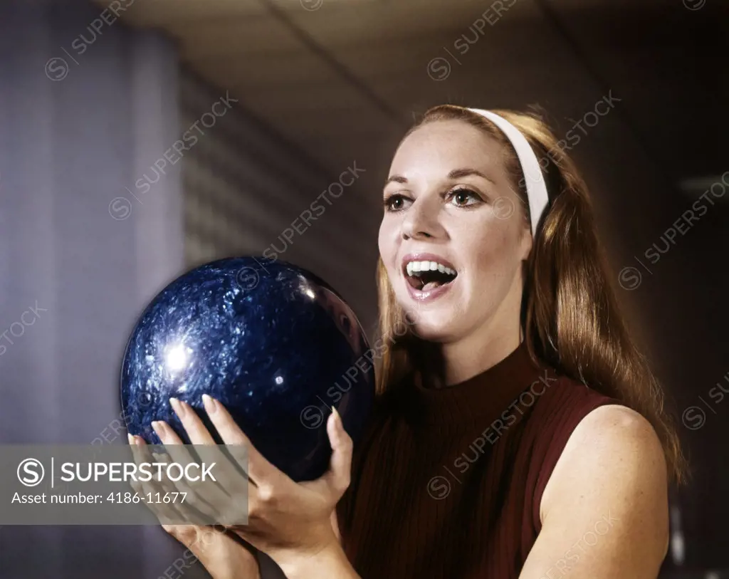 1960S Smiling Young Woman Holding Blue Bowling Ball