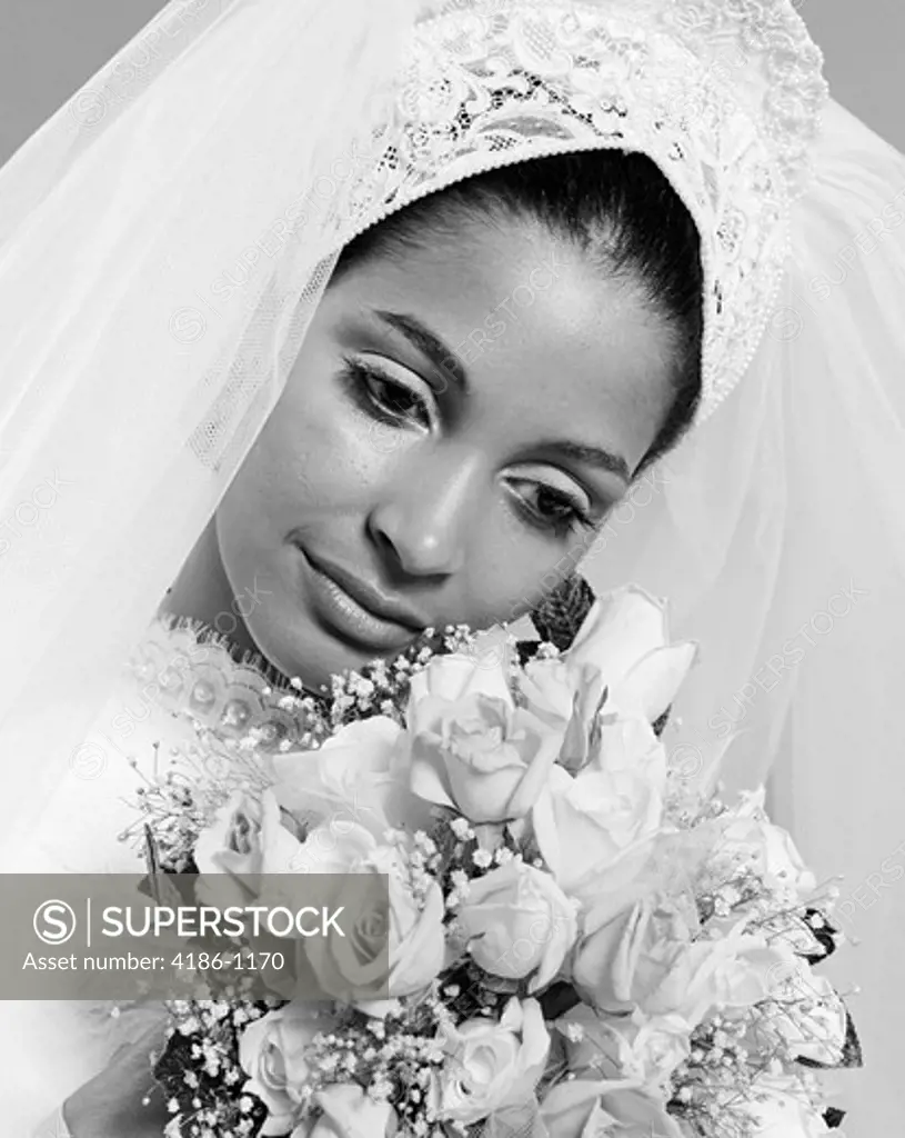 1970S Pensive African American Woman Bride Portrait With Bouquet Of Flowers
