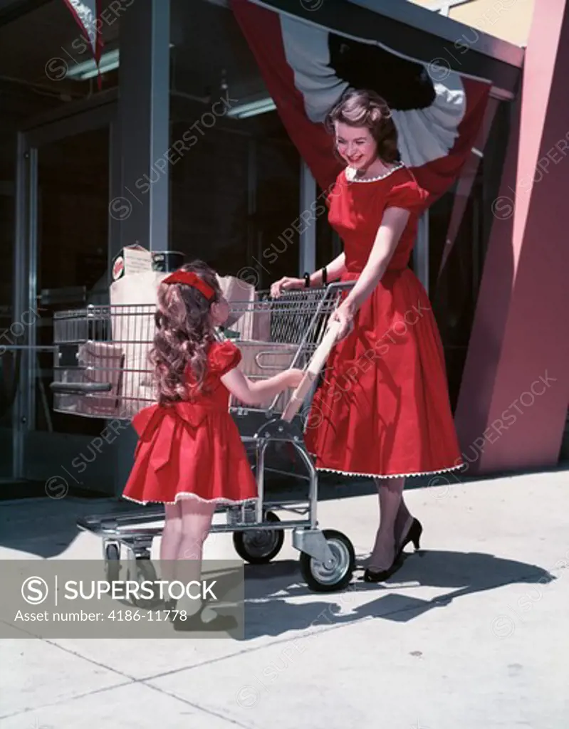 Mother & Daughter Outside Supermarket
