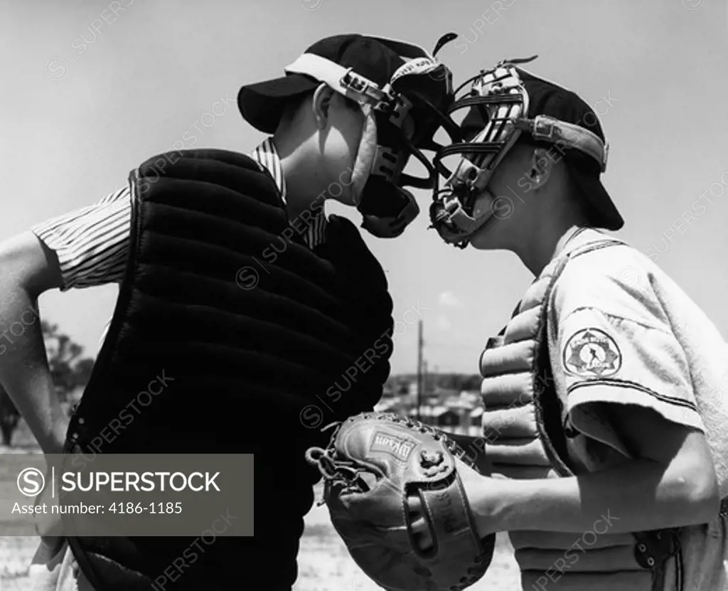 1950S 1960S Close-Up Of Youth League Umpire & Catcher Arguing Face To Face