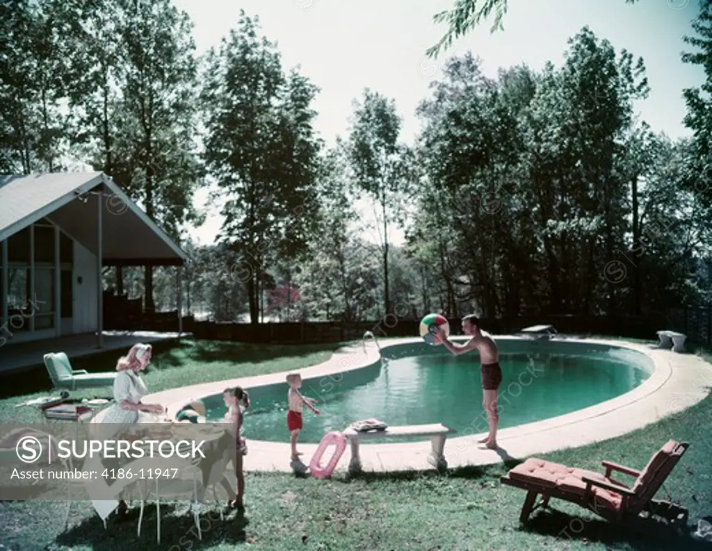 1950S Family Man Woman Son Daughter Backyard Kidney Shape Swimming Pool Picnic Food Beach Ball House Trees Summer