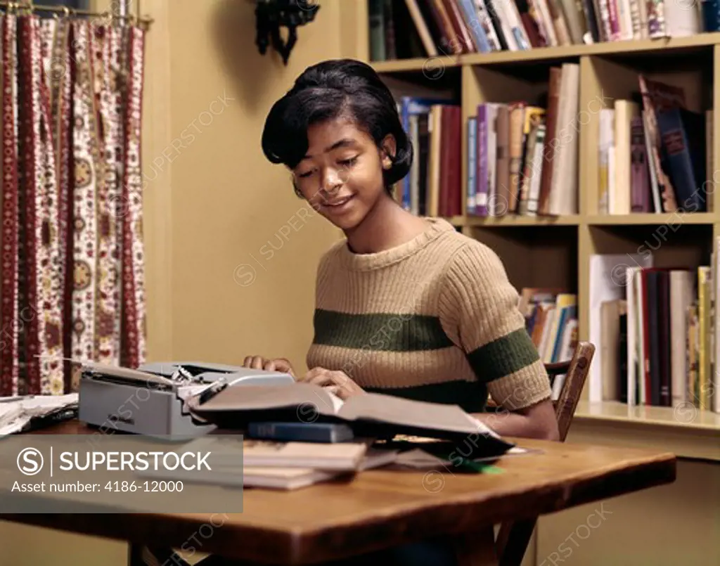 1970S Smiling Studious African American Teenage Girl Using Portable Typewriter