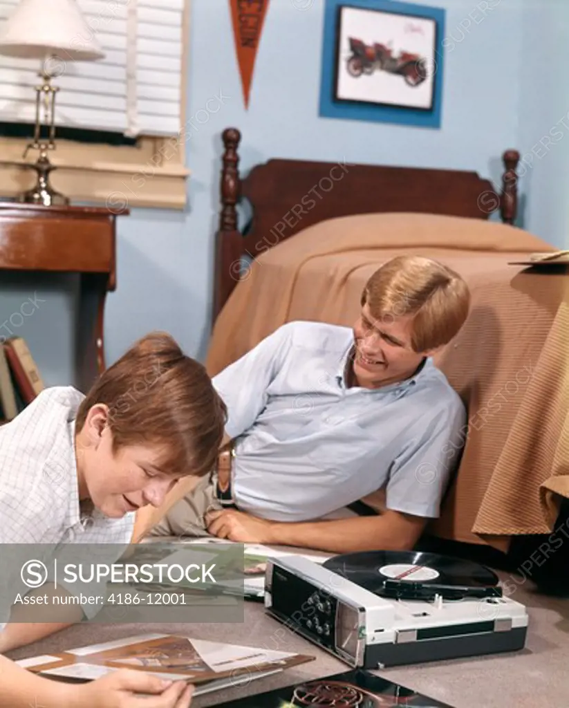 1970S Two Teen Boys Portable Record Player Listening To Music Records In Bedroom Dorm Room Dormitory