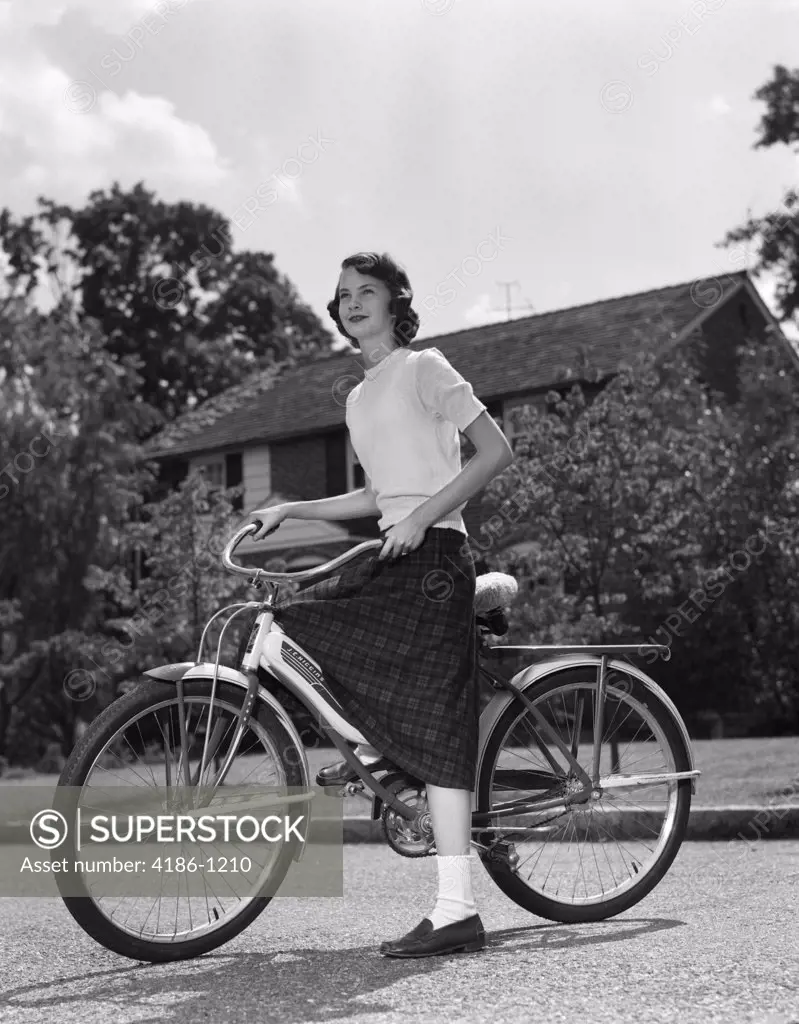 1950S Teenage Girl Standing With Bike