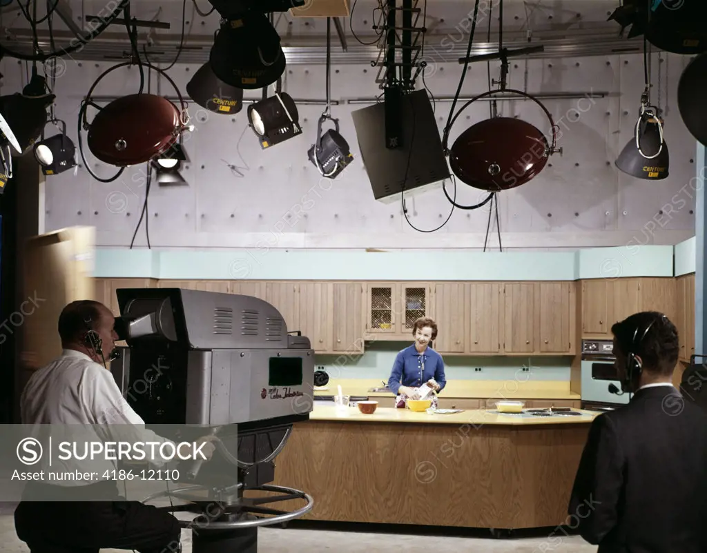 1960S Camera Man And Director In Studio Filming Woman Doing Cooking Show On Set
