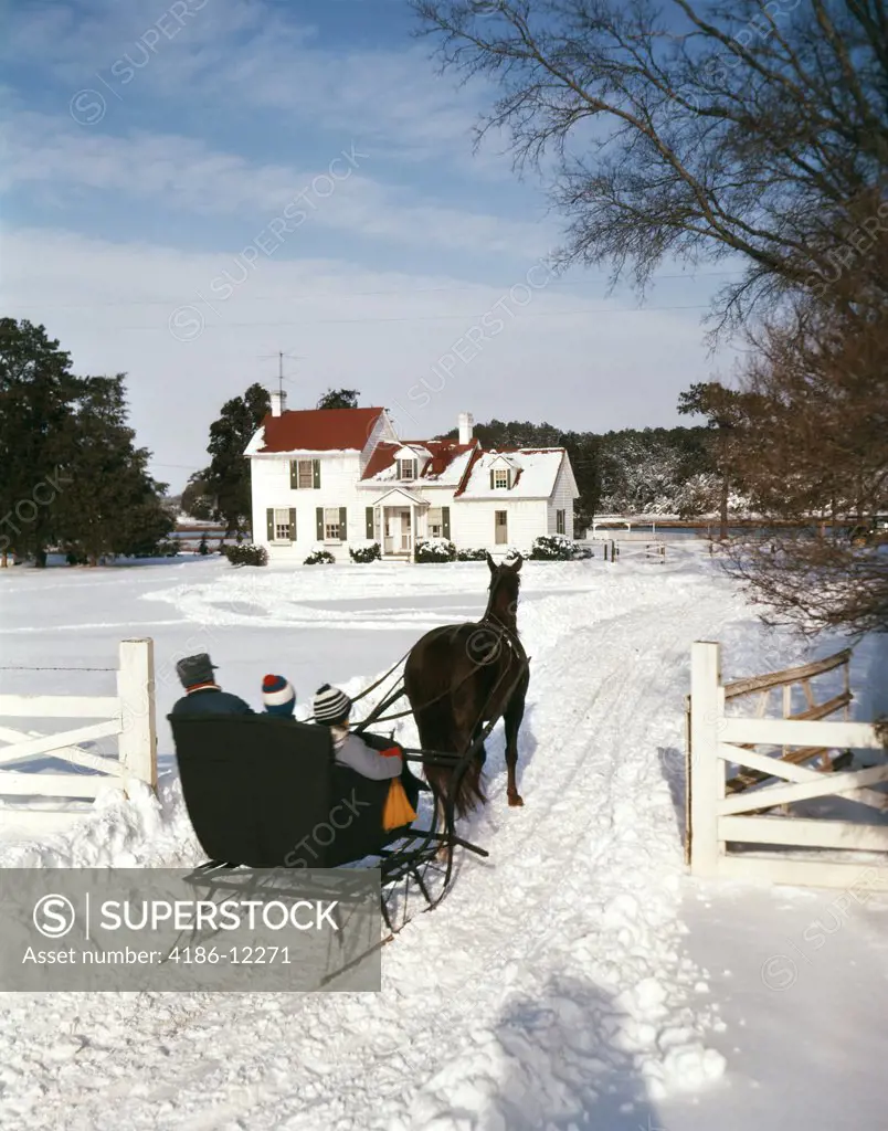 1960S People Riding In Horse Drawn Sleigh Over Snow Boy Girl Man Son Daughter Father Outdoor