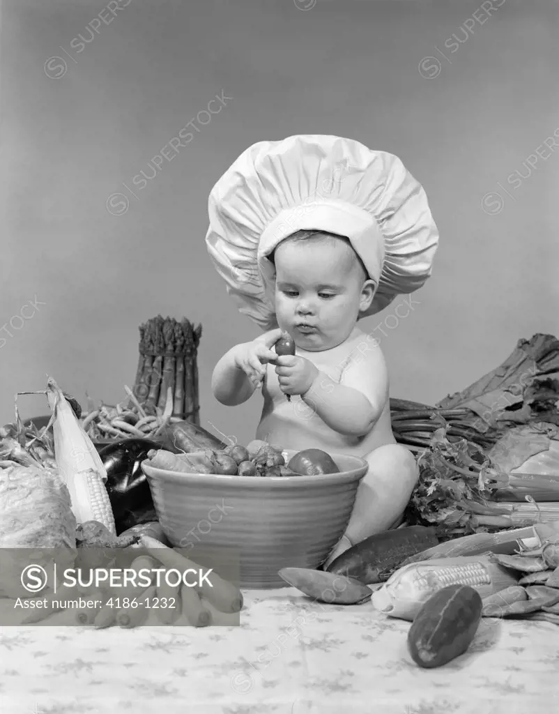 1950S 1960S Baby Wearing Chef Hat Toque Bowl And Raw Vegetables Making A Salad