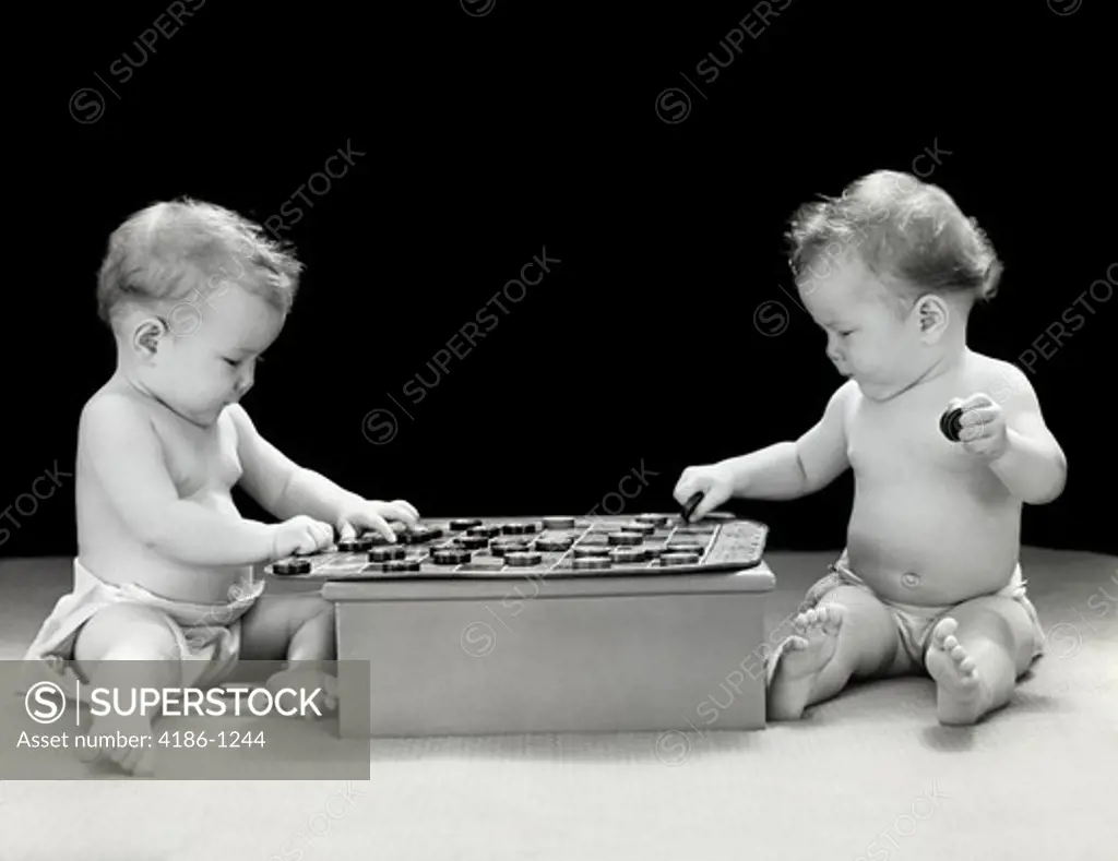 1930S 1940S Twin Babies Playing Game Of Checkers Together Studio