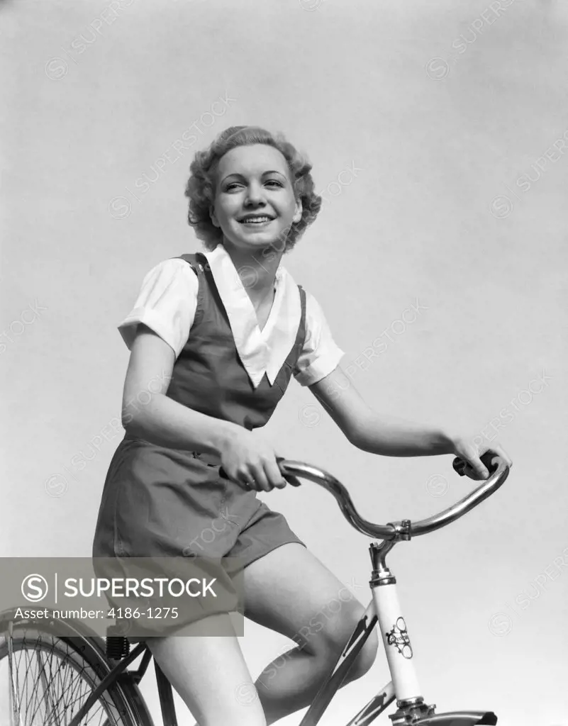 1930S Smiling Blond Woman On Bike