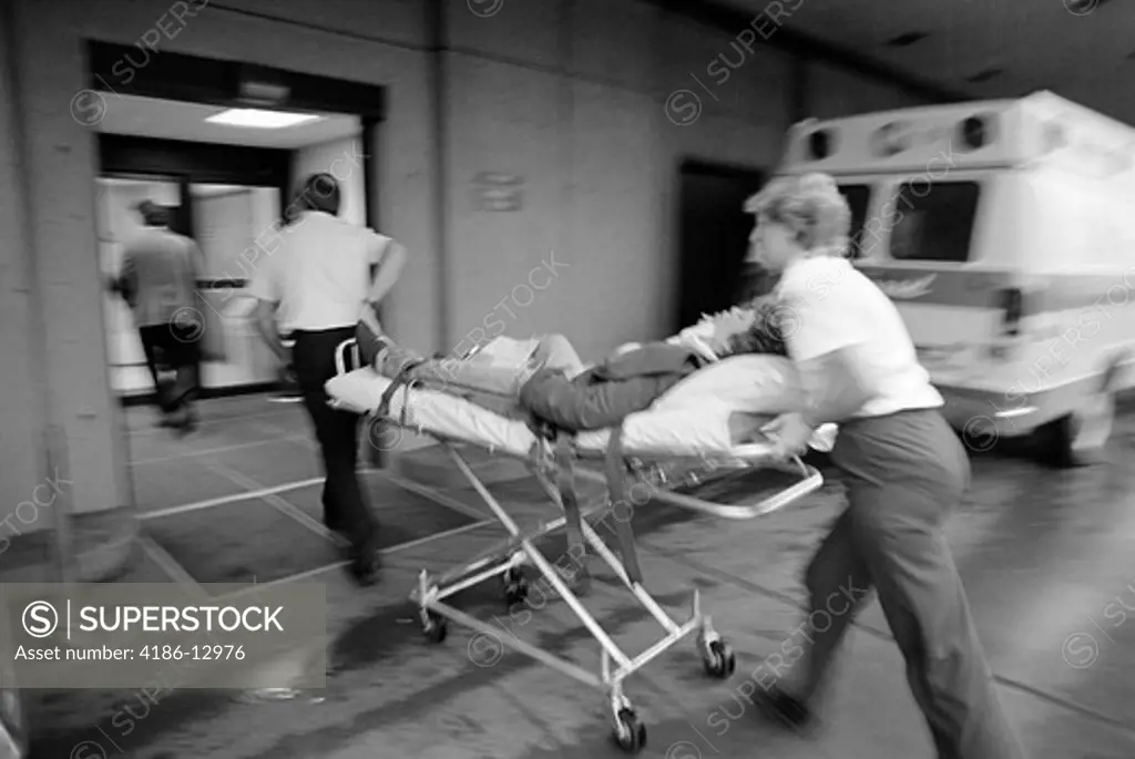 1980S Emt Team Rushing Patient Into Hospital On Stretcher
