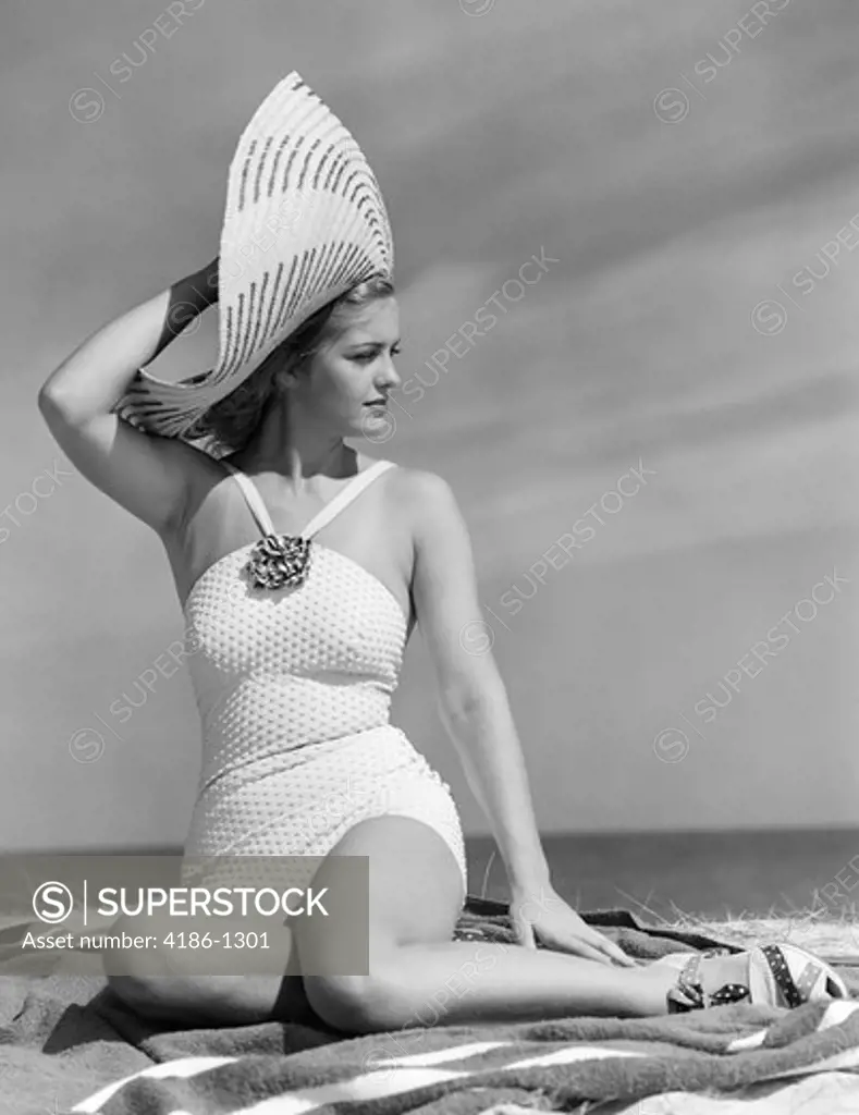1930S 1940S Woman In White Bathing Suit On Beach Wearing Big Straw Hat