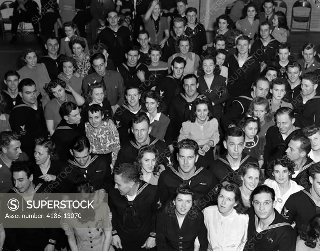 1940S Crowd Men Women Civilians Soldiers Sailors Looking Up Smiling At Camera Uso Center
