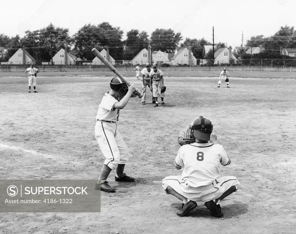 1960S Youth League Scene From Behind Plate With Player At Bat