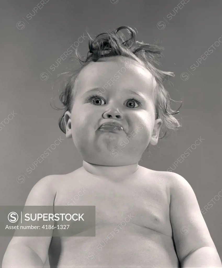 1950S Portrait Baby With Messy Hair & Pursed Lips