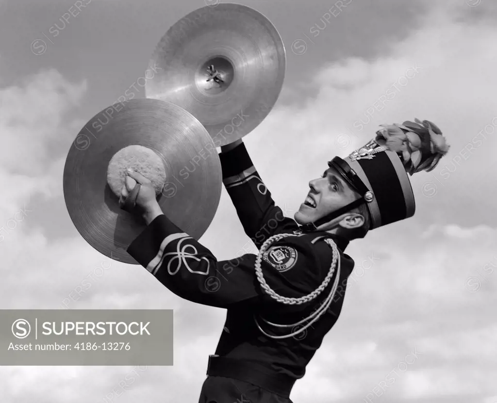 1960S Portrait Of Boy In Band Uniform Playing Instrument Cymbals Outdoors