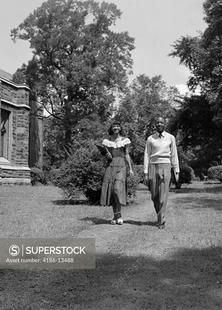 1940S 1950S African American College Couple Walking On Campus Carrying Books