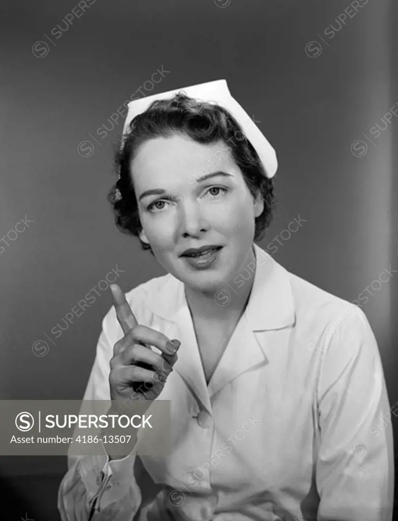 1950S Nurse Woman Portrait Wagging One Finger Towards Camera Admonishing Lecture Health Care Warning