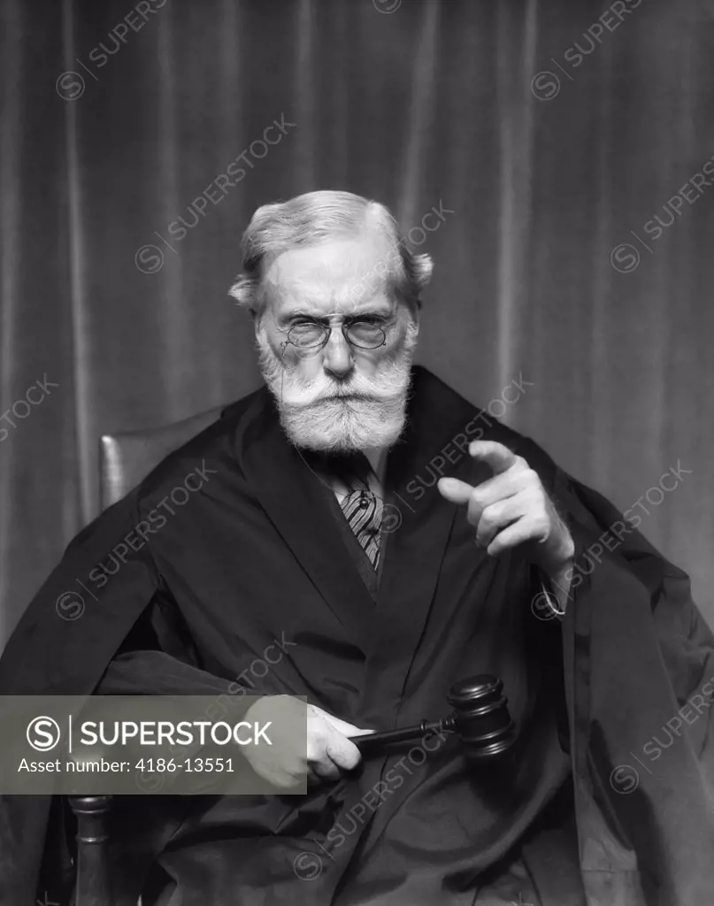 1930S Stern Elderly Judge With Beard And Glasses Pointing At Camera