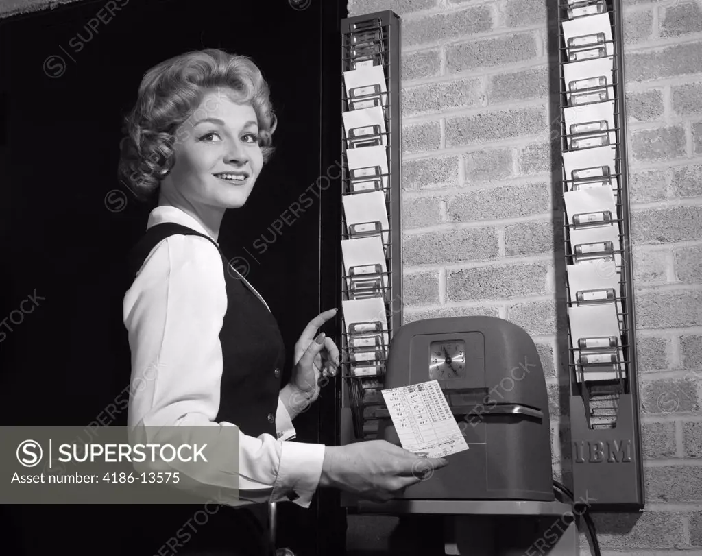 1950S Woman In Office With Timecard And Timecard Clock