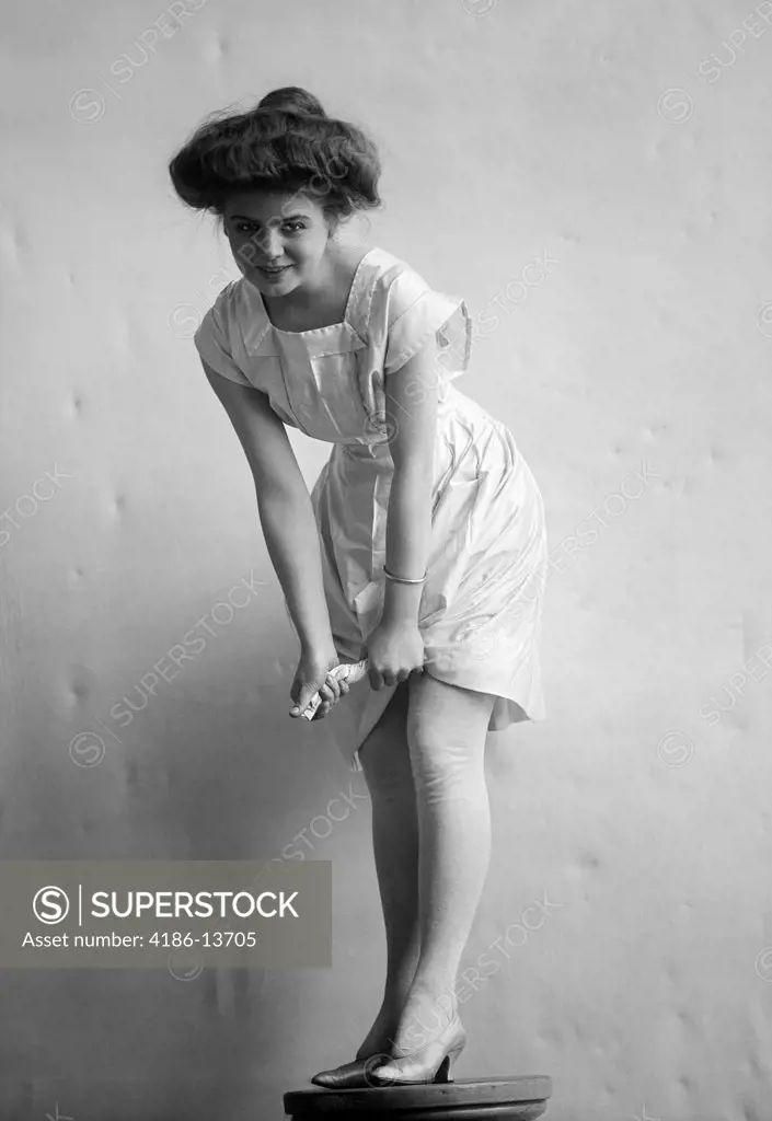 1900S 1910S Smiling Woman With Gibson Girl Hair Style Ringing Out Wet Chemise Hemline