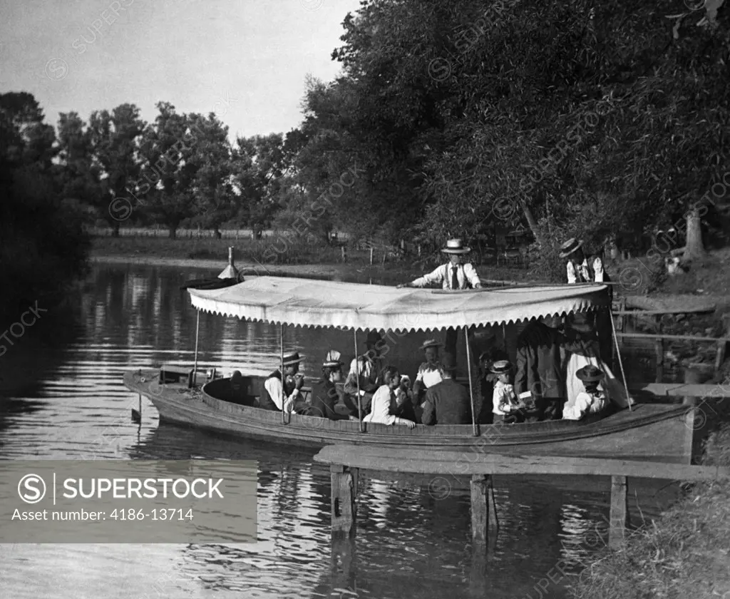 1890S 1900S Turn Of The Century Group In Boat With Canopy Being Pushed Out Into Lake