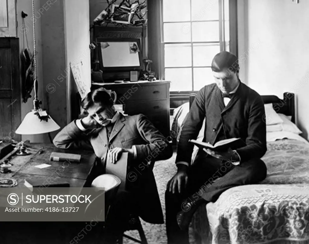 1890S 1894 Pair Of Male Students Studying In Dorm Room