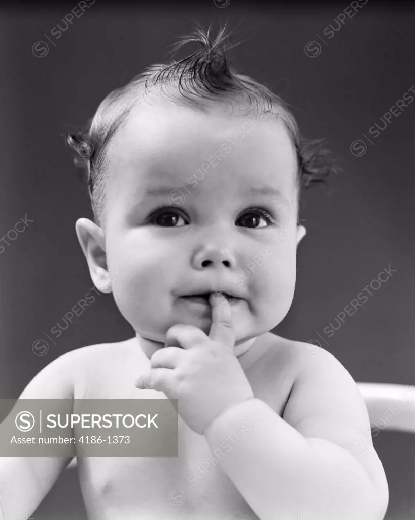 1940S Thoughtful Baby With Finger In Mouth
